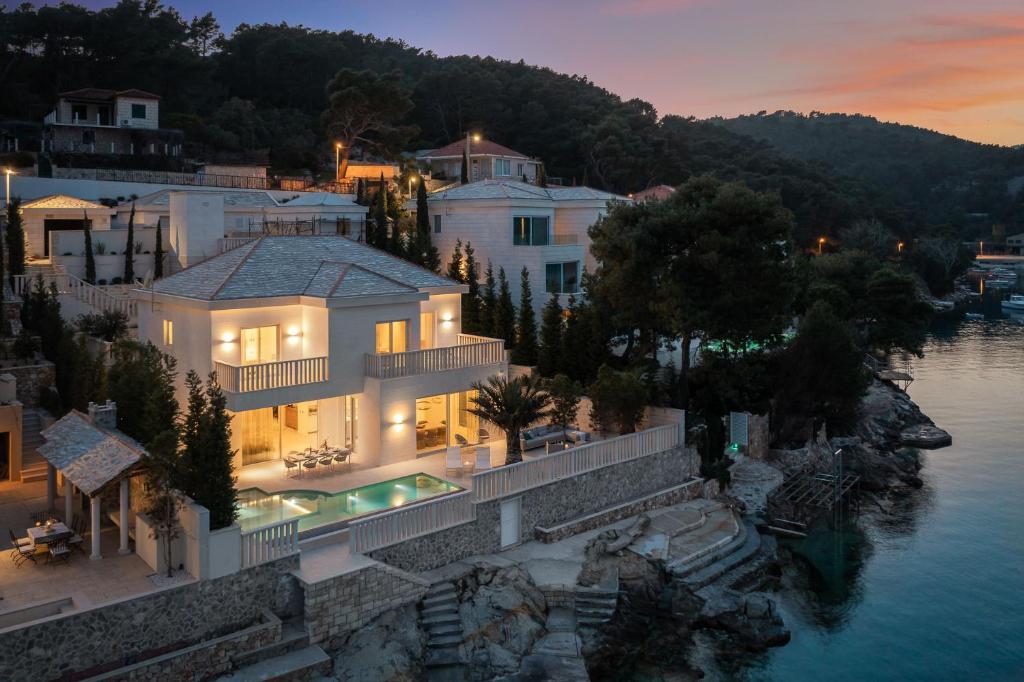 an aerial view of a house by the water at Villa More in Selca