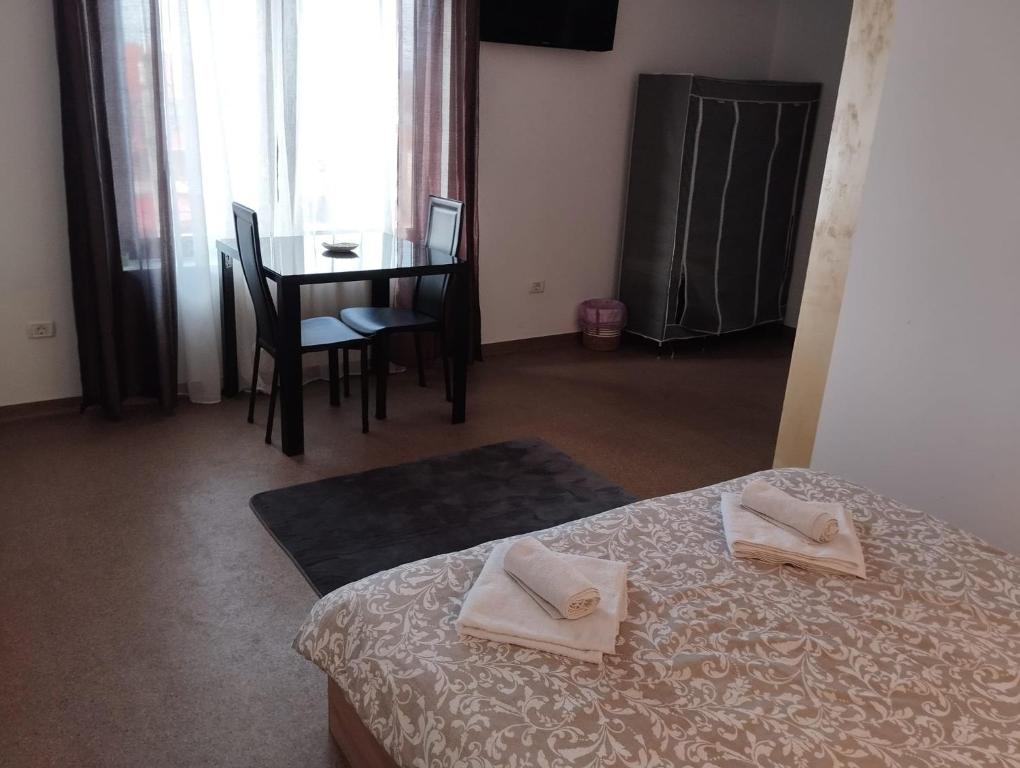 Postel nebo postele na pokoji v ubytování Hotel ENZO