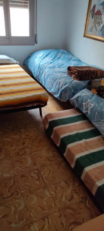 Posteľ alebo postele v izbe v ubytovaní Apartament Volcà Aiguanegra
