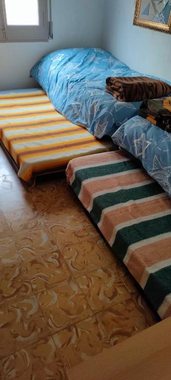 Posteľ alebo postele v izbe v ubytovaní Apartament Volcà Aiguanegra