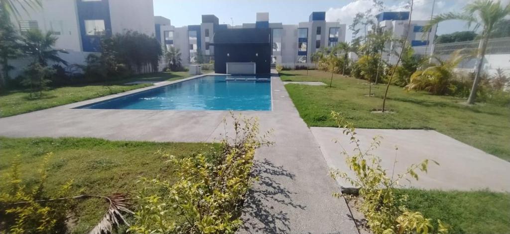 a swimming pool in front of a building at Puerto Vallarta in Los Algodones