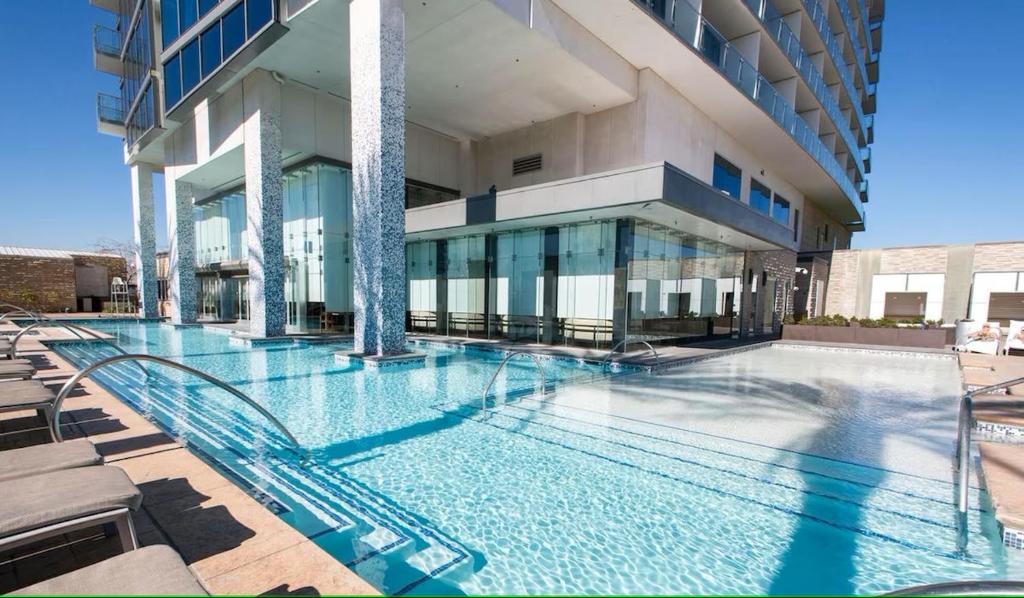 a large swimming pool in front of a building at Palms Place Studio 30th floor in Las Vegas