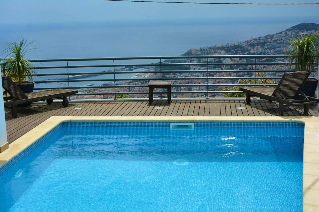 The swimming pool at or close to 3 bedrooms house with private pool terrace and wifi at Funchal 3 km away from the beach