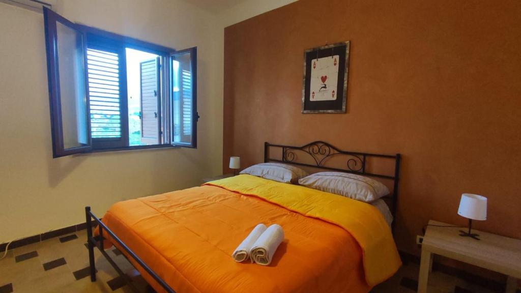 Postel nebo postele na pokoji v ubytování Casa Di Mitri