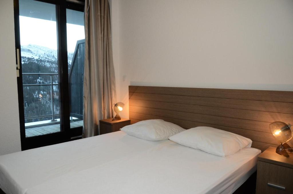 Llit o llits en una habitació de Résidence Les Terrasses De Veret - 2 Pièces pour 4 Personnes 91