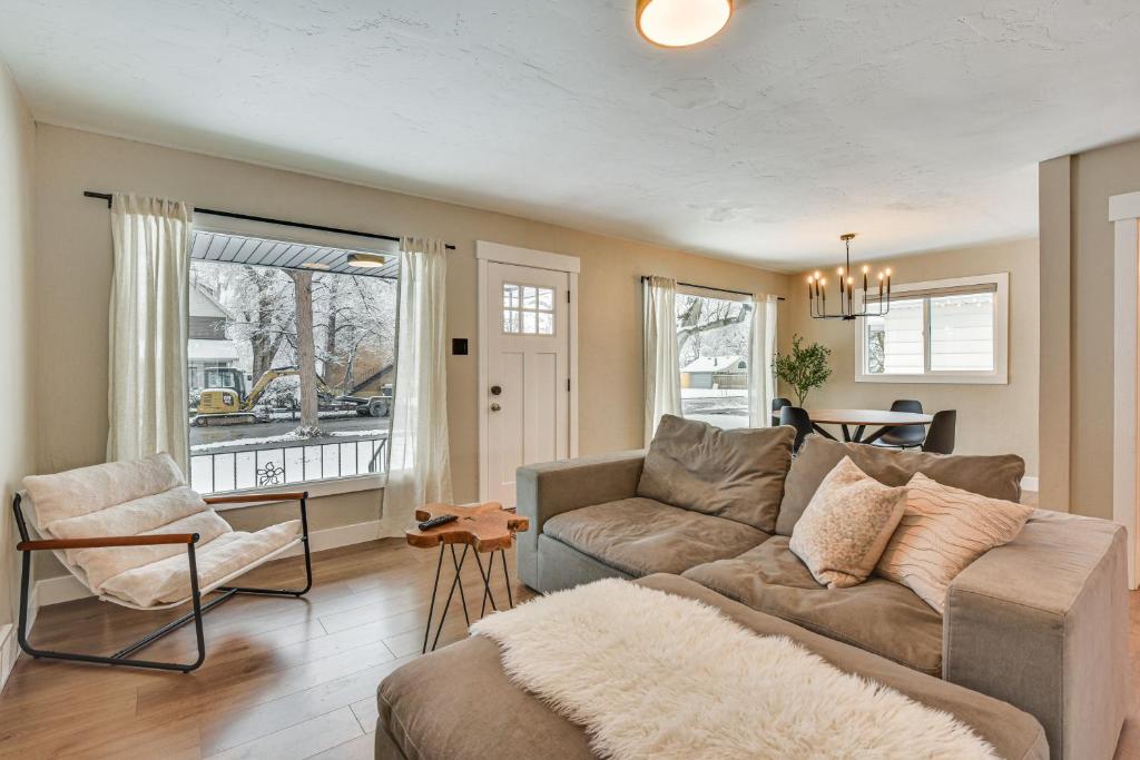a living room with a couch and a chair at Pet-Friendly Salt Lake City Getaway Near Skiing! in Salt Lake City