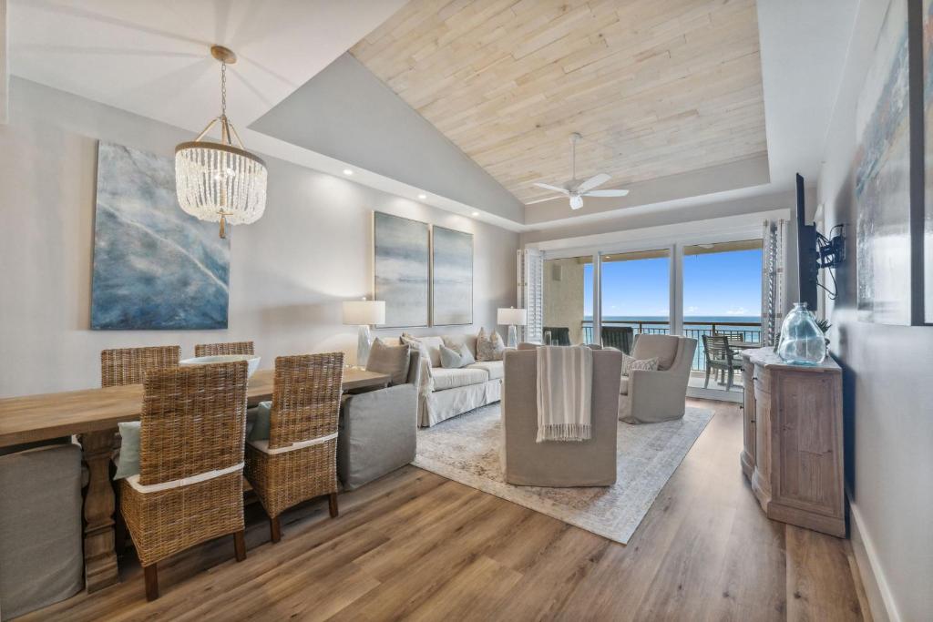 a dining room and living room with a table and chairs at HP 45W What the Heck by 30A Escapes in Rosemary Beach