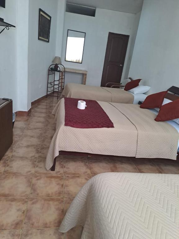 Postel nebo postele na pokoji v ubytování Atlantic Suites Hotel