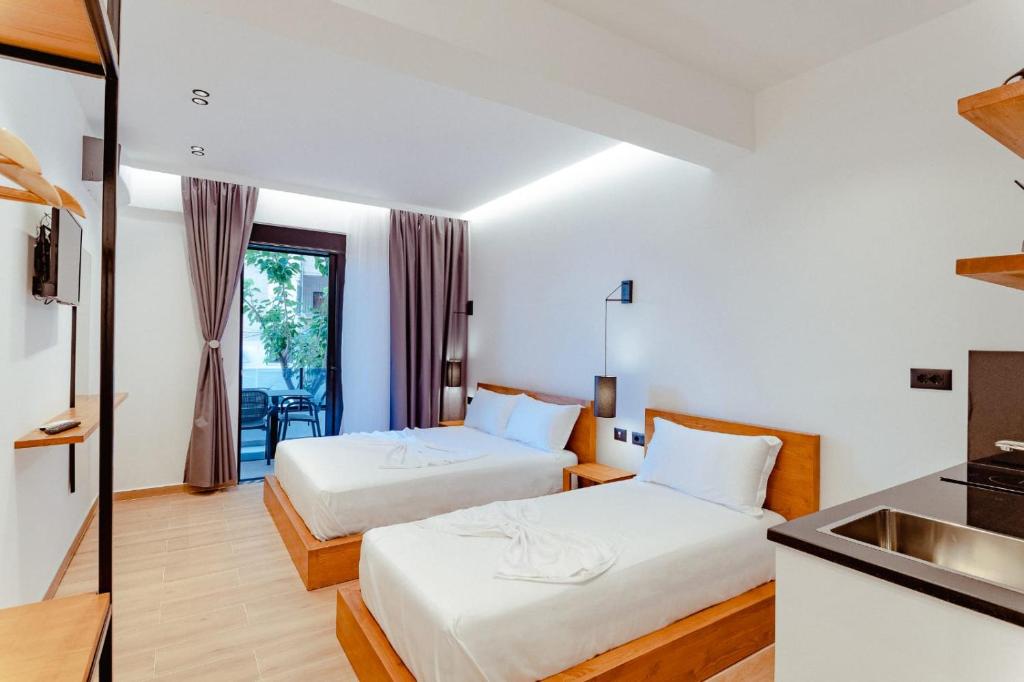 Postel nebo postele na pokoji v ubytování Gloal Suites & Residence