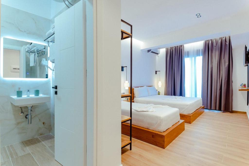 Postel nebo postele na pokoji v ubytování Gloal Suites & Residence