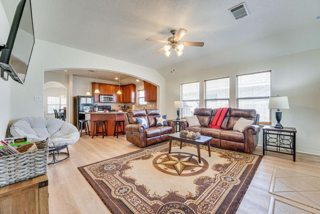 a living room with a couch and a table at San Antonio Home with Game Room, 9 Mi to SeaWorld! in San Antonio