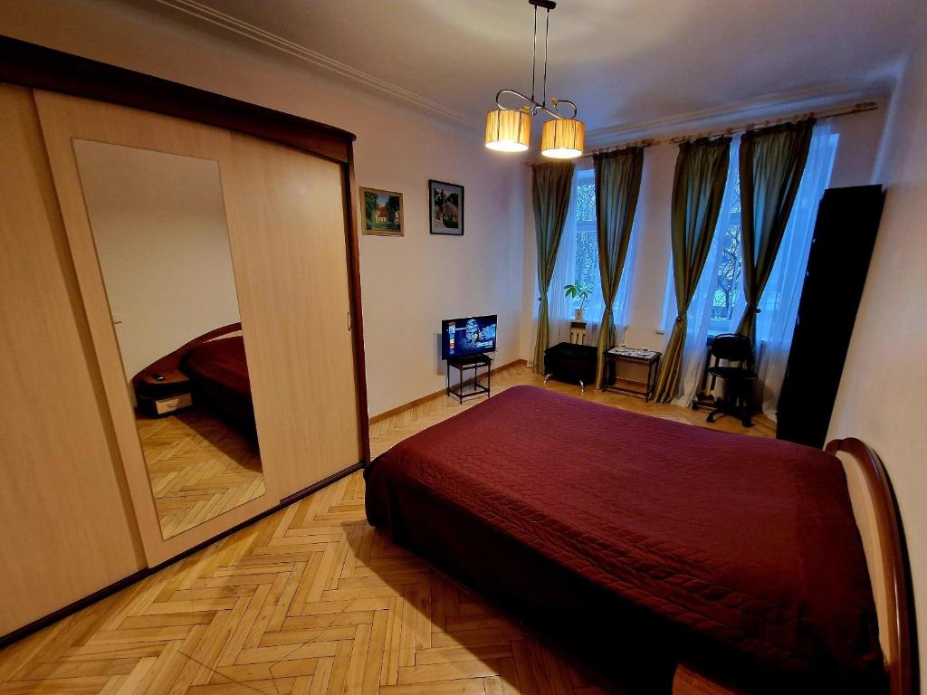 Postel nebo postele na pokoji v ubytování Kaunas Center Apartment