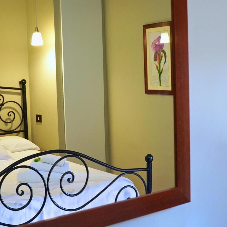 Postel nebo postele na pokoji v ubytování Al Piccolo Borgo Locanda Con Alloggio
