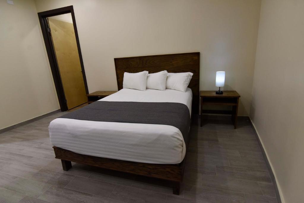 Postel nebo postele na pokoji v ubytování Hotel Dunas Near Consulate