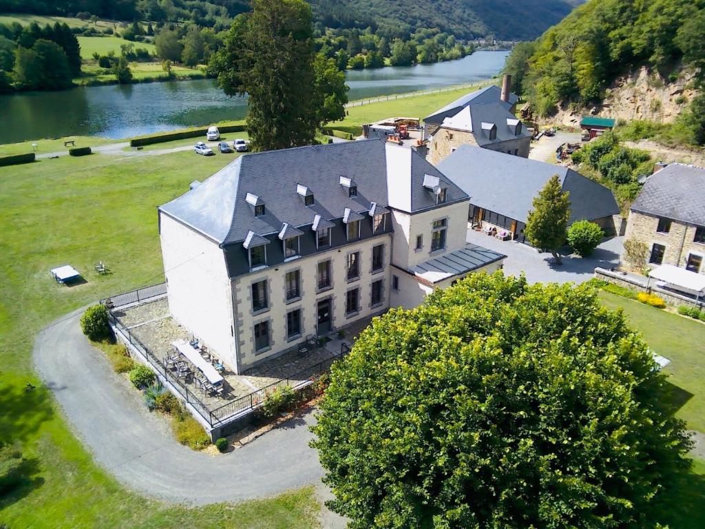 an aerial view of a large house with a tree at Domaine Chateau le Risdoux 20pers, unieke locatie in Vireux-Wallerand