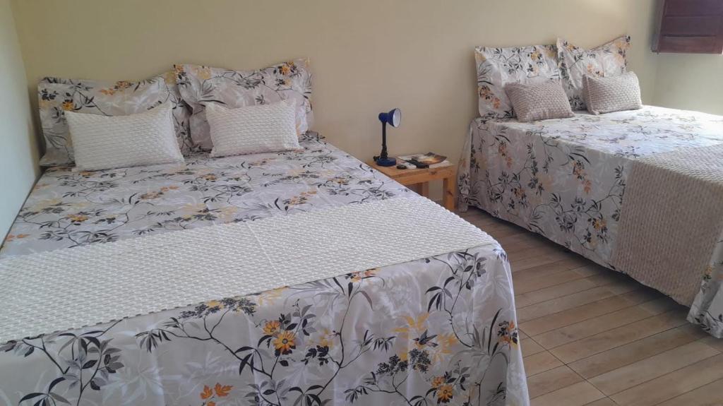 Postel nebo postele na pokoji v ubytování Vila Itacimirim