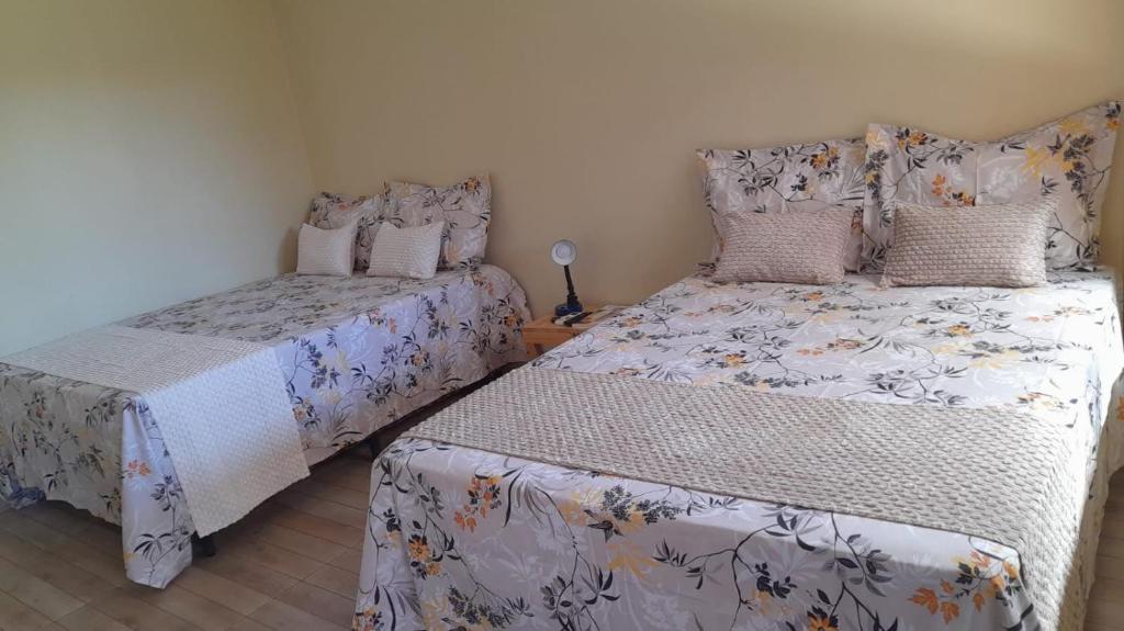 Postel nebo postele na pokoji v ubytování Vila Itacimirim