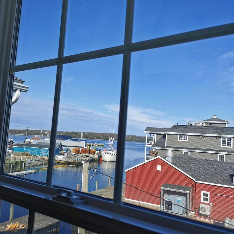 a view of a harbor from a window at The Inn at Fisherman's cove in Halifax