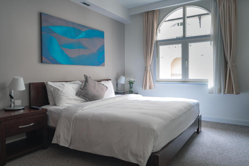 Postel nebo postele na pokoji v ubytování Central Mansions Serviced Apartments
