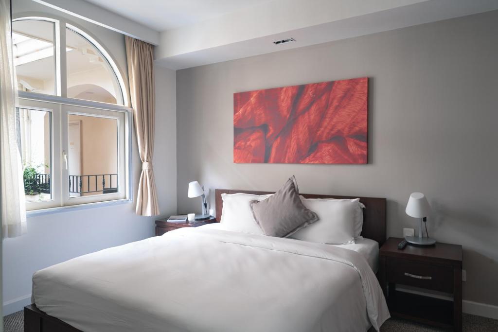 Postel nebo postele na pokoji v ubytování Central Mansions Serviced Apartments