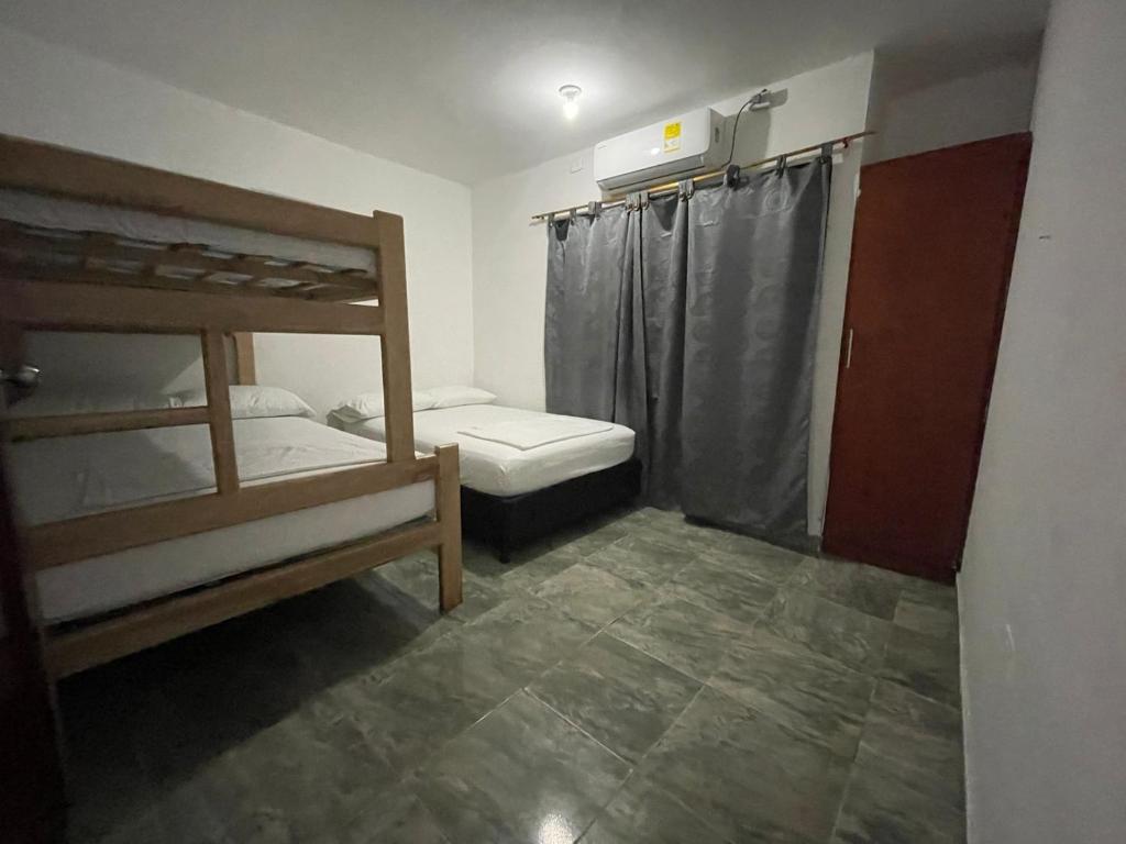 Postel nebo postele na pokoji v ubytování Apartamentos Poseidon