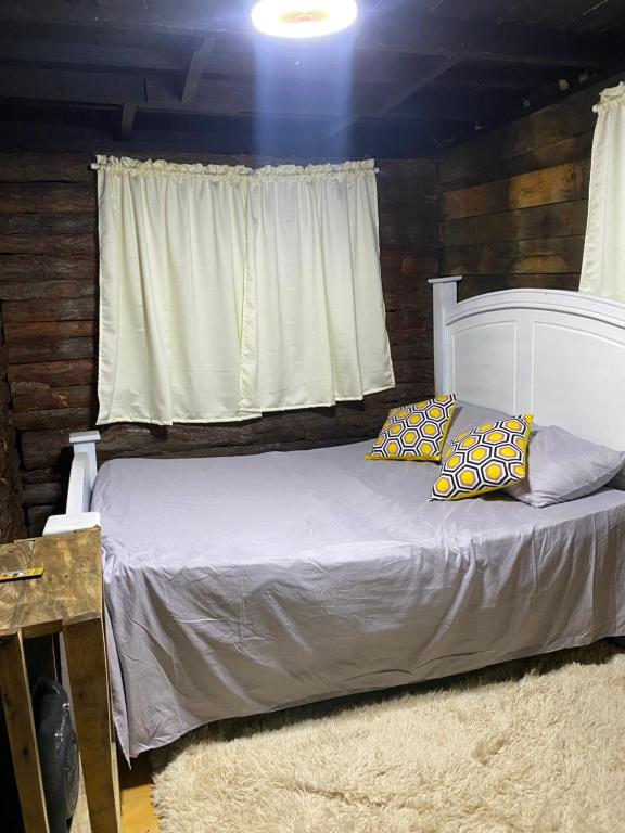 Ένα ή περισσότερα κρεβάτια σε δωμάτιο στο Villa Alpina