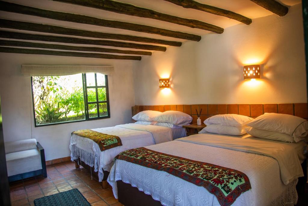 Postel nebo postele na pokoji v ubytování Casa San Nicolas