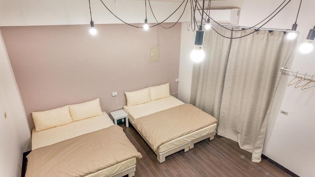Postel nebo postele na pokoji v ubytování Maybe Homestay