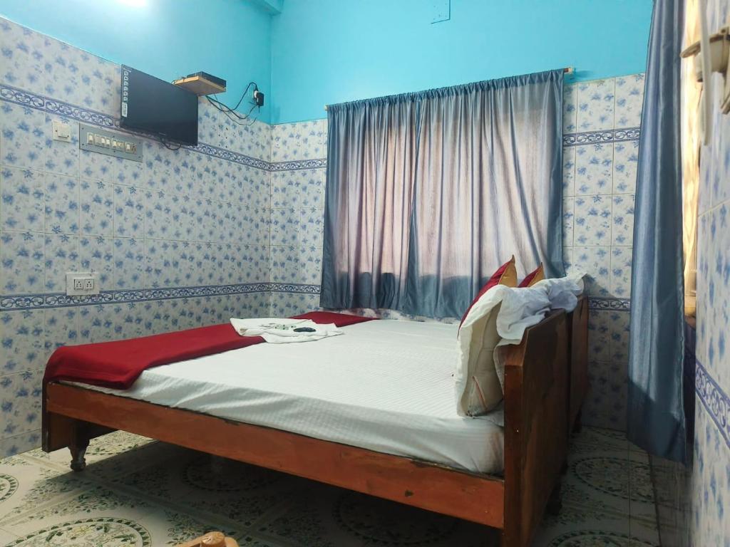 Postel nebo postele na pokoji v ubytování Sri Kanya Residency, Srikalahasti