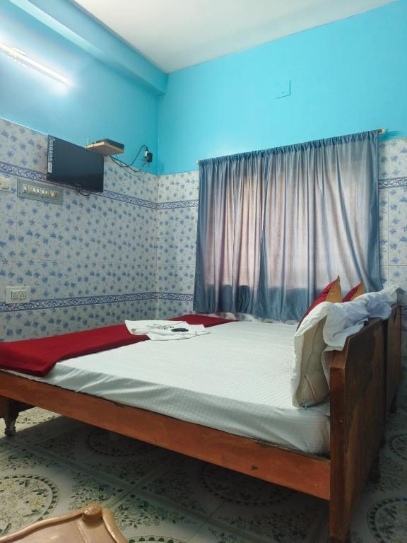 Postel nebo postele na pokoji v ubytování Sri Kanya Residency, Srikalahasti
