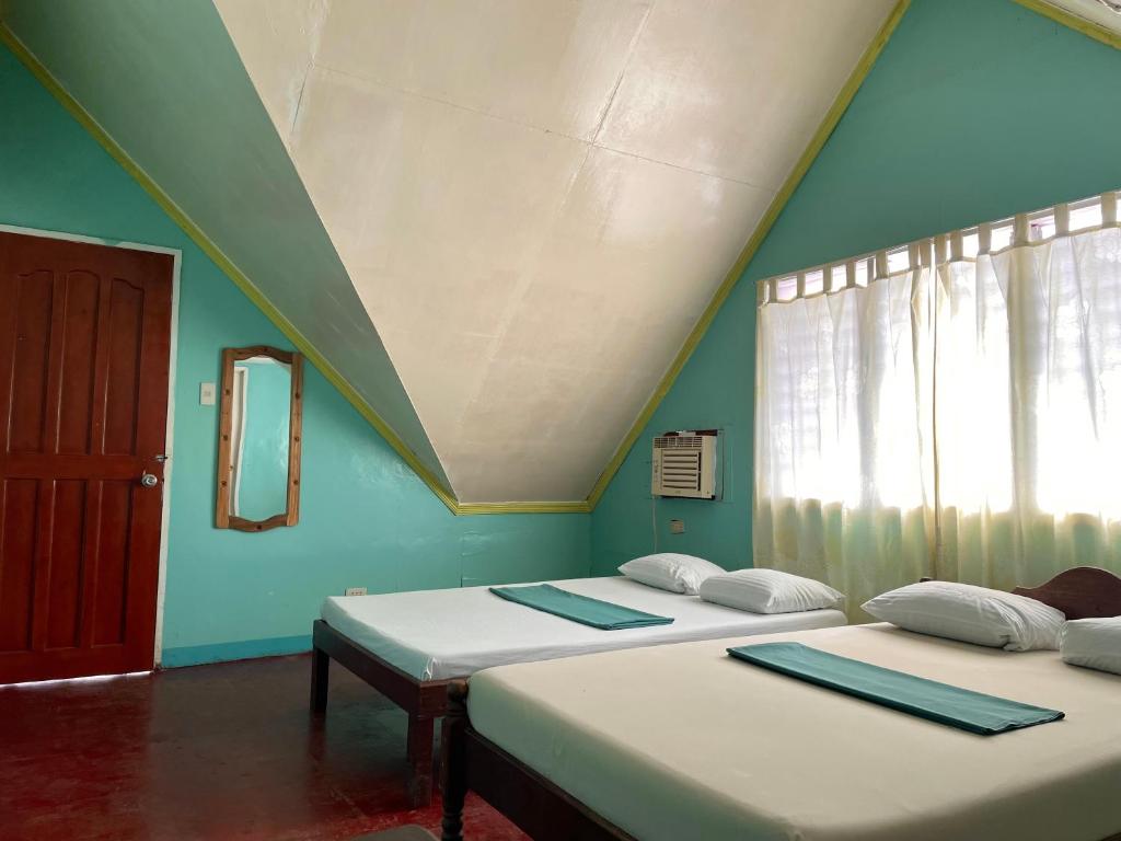Postel nebo postele na pokoji v ubytování Oasis Resthouse