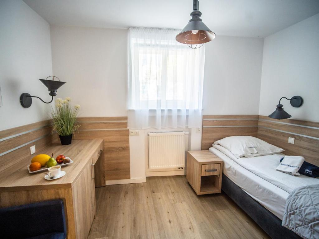 Postel nebo postele na pokoji v ubytování Sanatorium Mewa