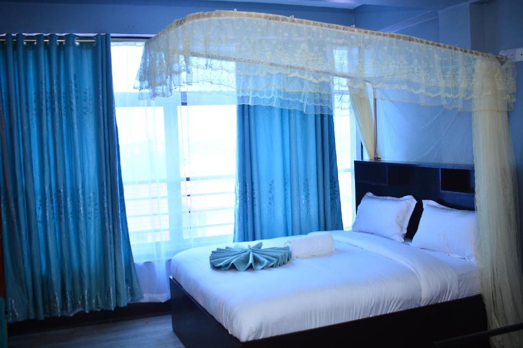 Postel nebo postele na pokoji v ubytování BRIMAK HOTEL
