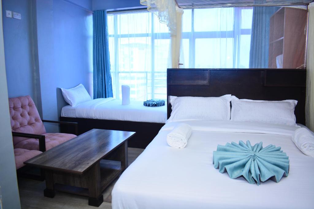 Postel nebo postele na pokoji v ubytování BRIMAK HOTEL