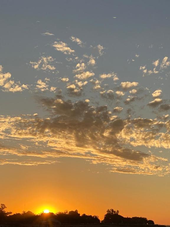 an image of a sunset with clouds in the sky at propiedad fuera de disponibilidad in Paso de la Patria