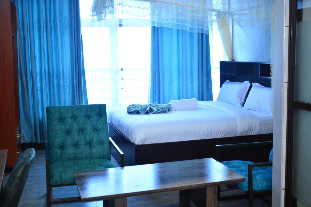 Postel nebo postele na pokoji v ubytování BRIMAK HOTEL