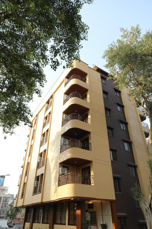 a tall building with balconies on the side of it at Vits Select Kharadi Pune in Pune