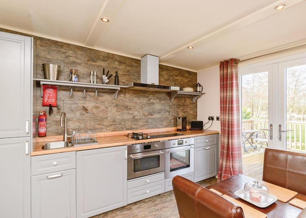 A kitchen or kitchenette at Pickering Lodges