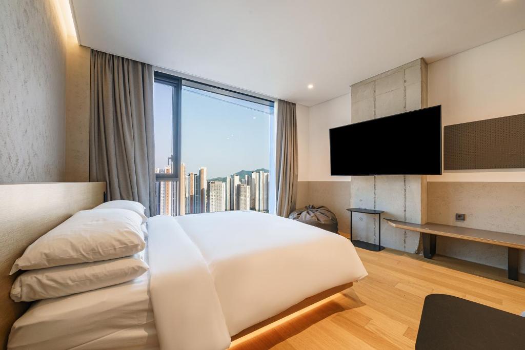 Postel nebo postele na pokoji v ubytování Take Hotel Seoul Gwangmyeong