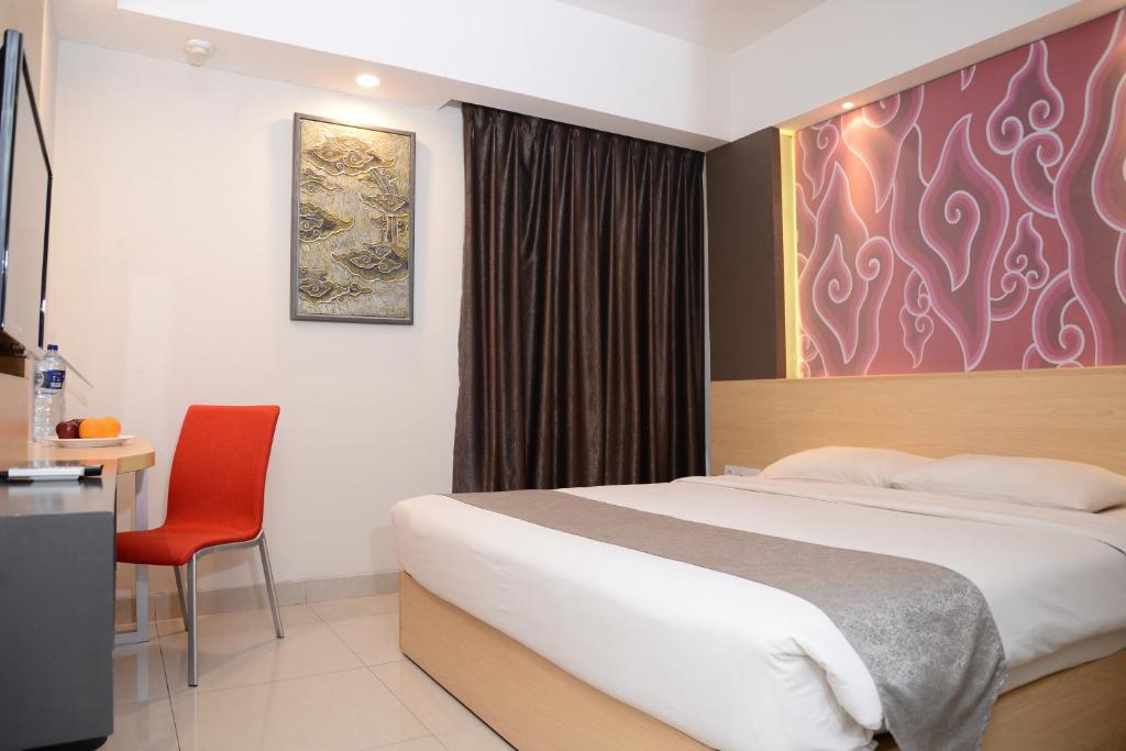 Postel nebo postele na pokoji v ubytování Metland Hotel Cirebon