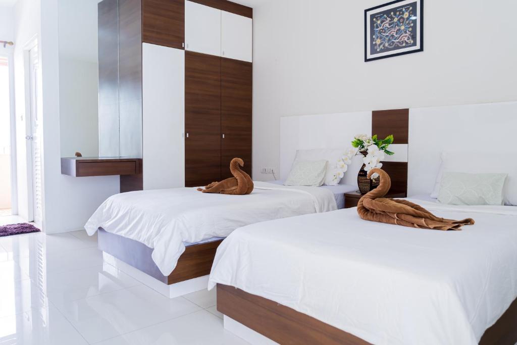 Postel nebo postele na pokoji v ubytování The Infinity Suite Chiangrai