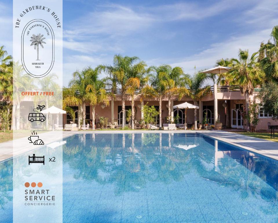 a picture of a swimming pool in front of a resort at The Gardener's House, Petit déjeuner inclus in Marrakesh