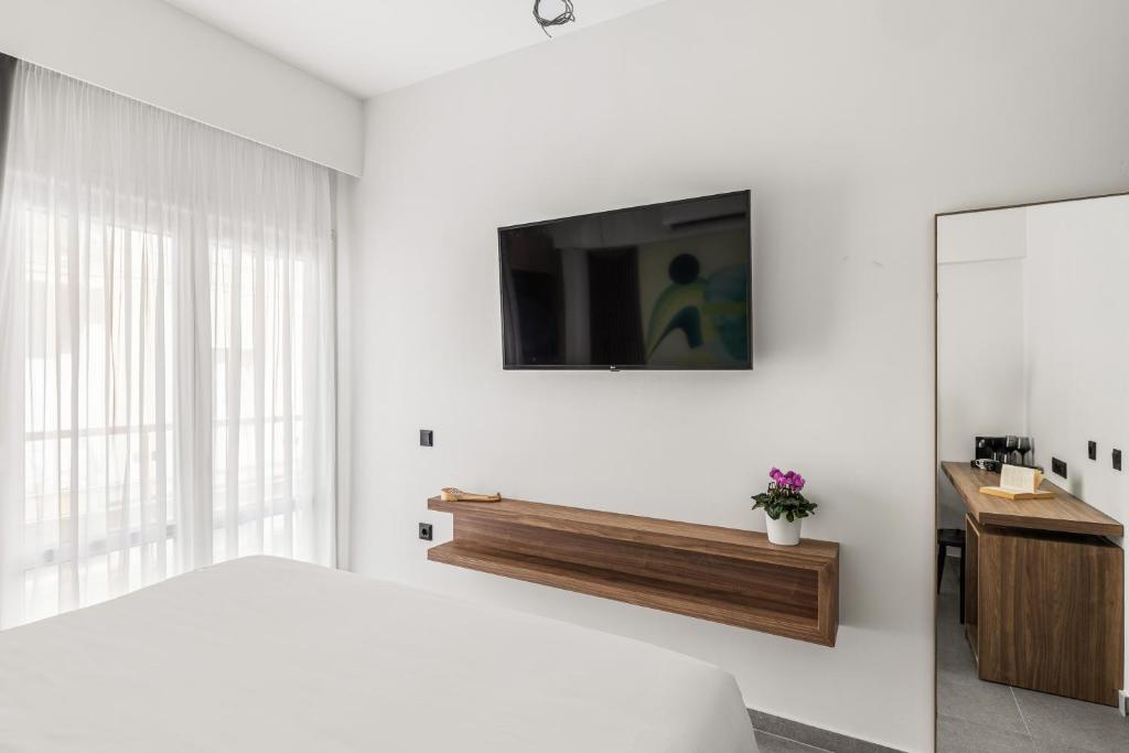 TV a/nebo společenská místnost v ubytování The Q Hotel