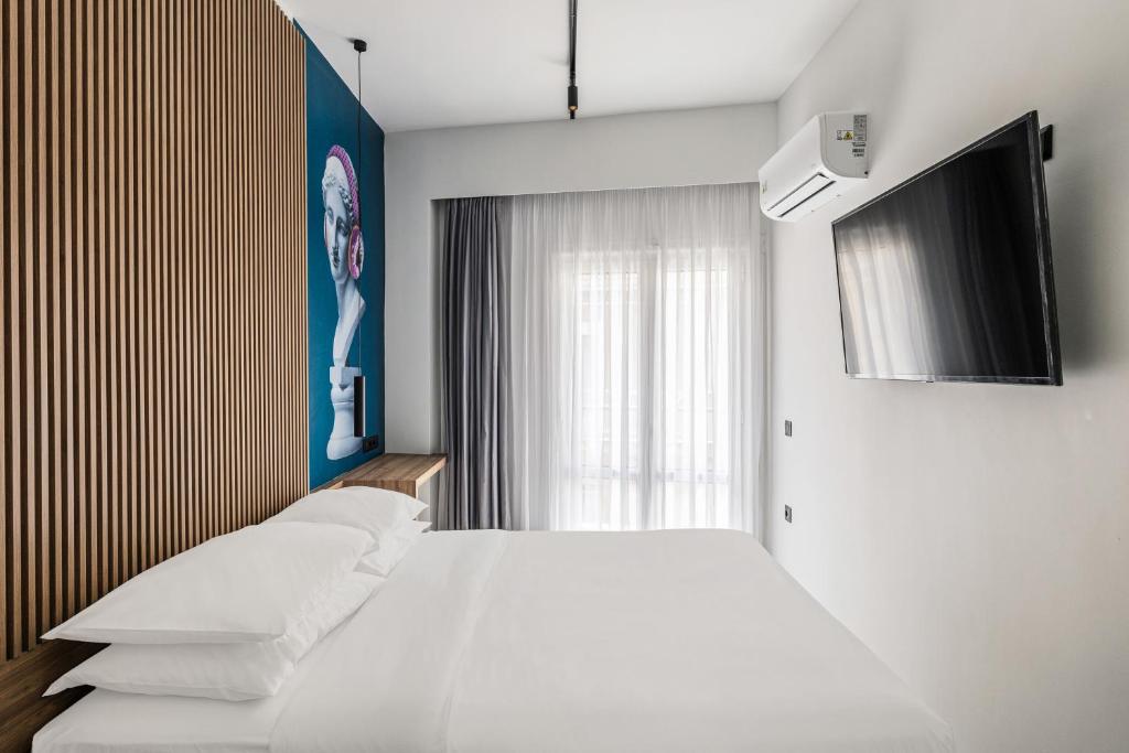 TV a/nebo společenská místnost v ubytování The Q Hotel