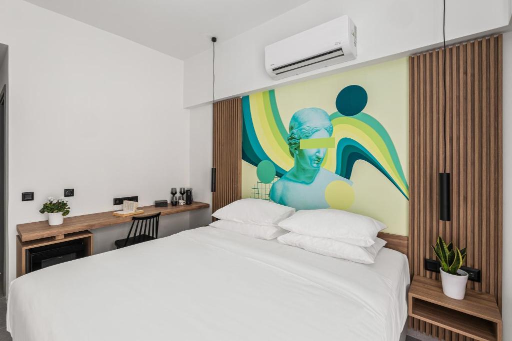 Postel nebo postele na pokoji v ubytování The Q Hotel