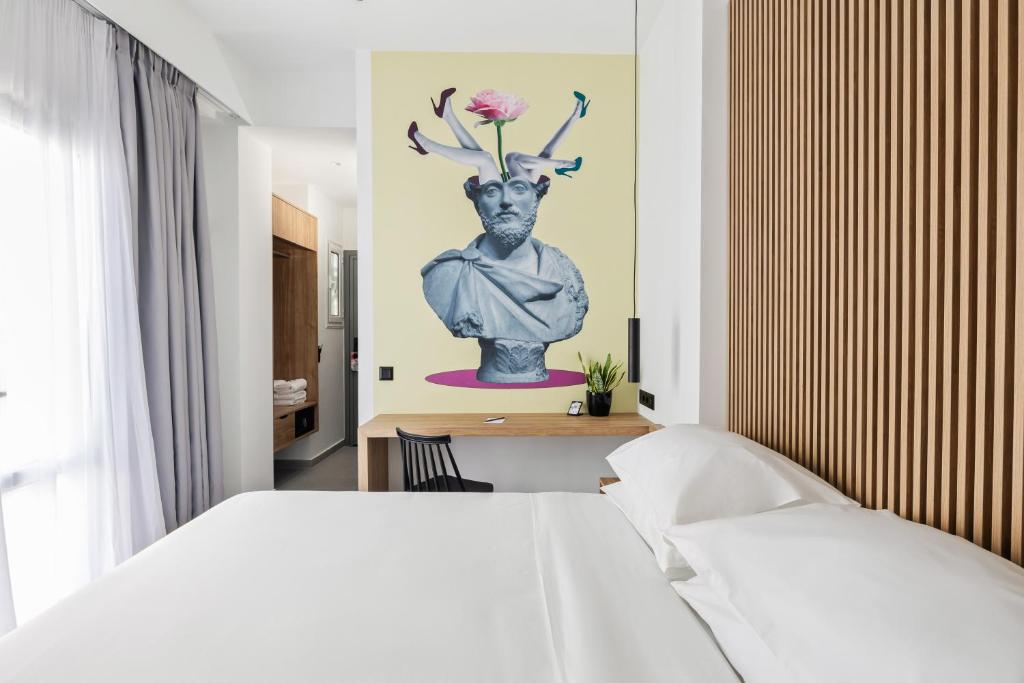 Postel nebo postele na pokoji v ubytování The Q Hotel