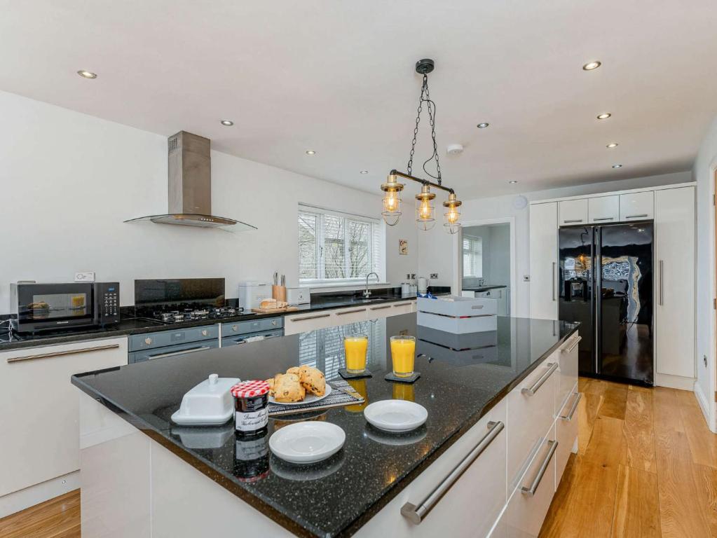 a kitchen with a black counter top in a room at 4 Bed in Penygroes 86423 in Pen-y-groes