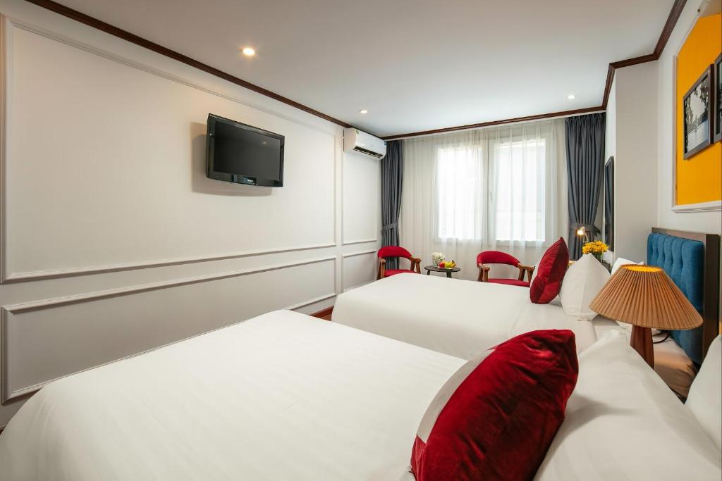 Postel nebo postele na pokoji v ubytování Silk Flower Hotel & Spa