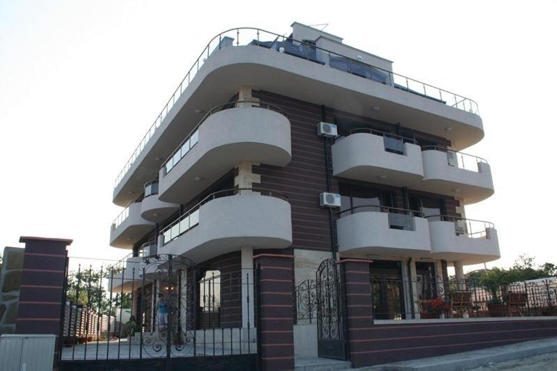 a large building with balconies on the side of it at Silistar Hotel in Rezovo