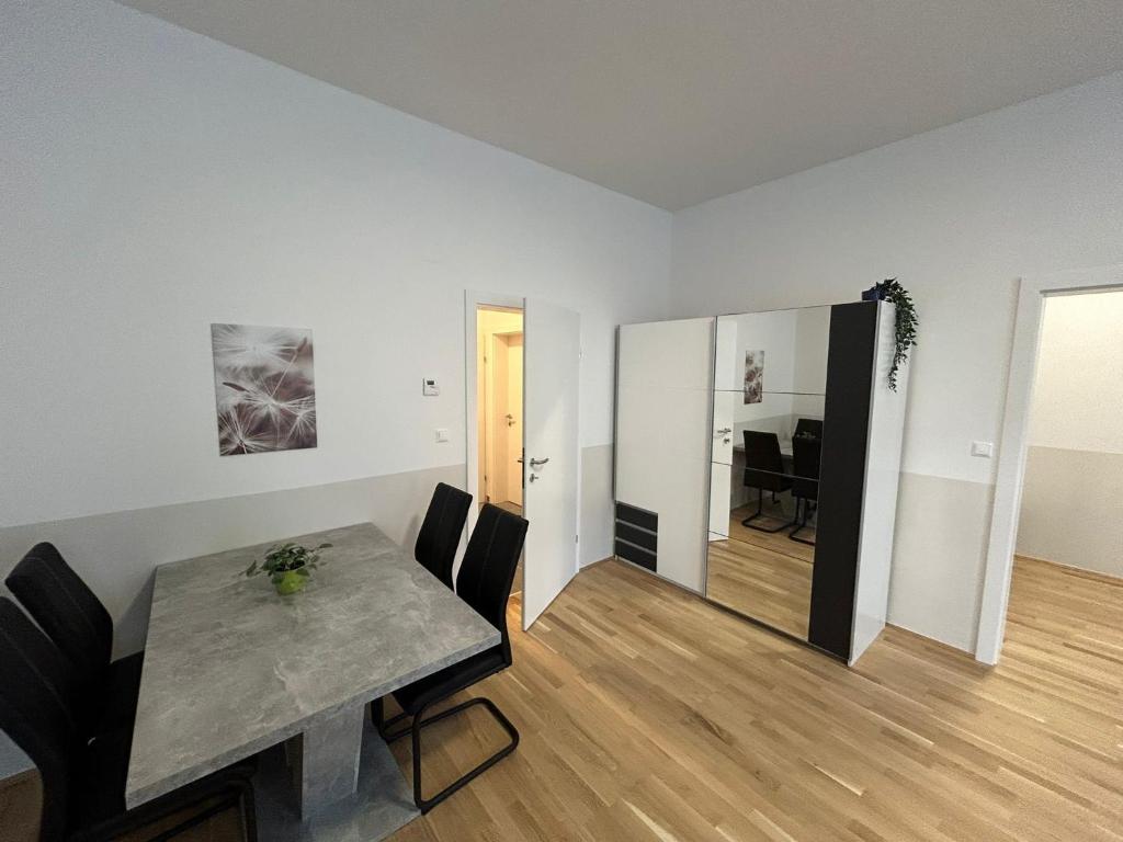 a living room with a table and a dining room at Paky Appartements 00209 in Vienna